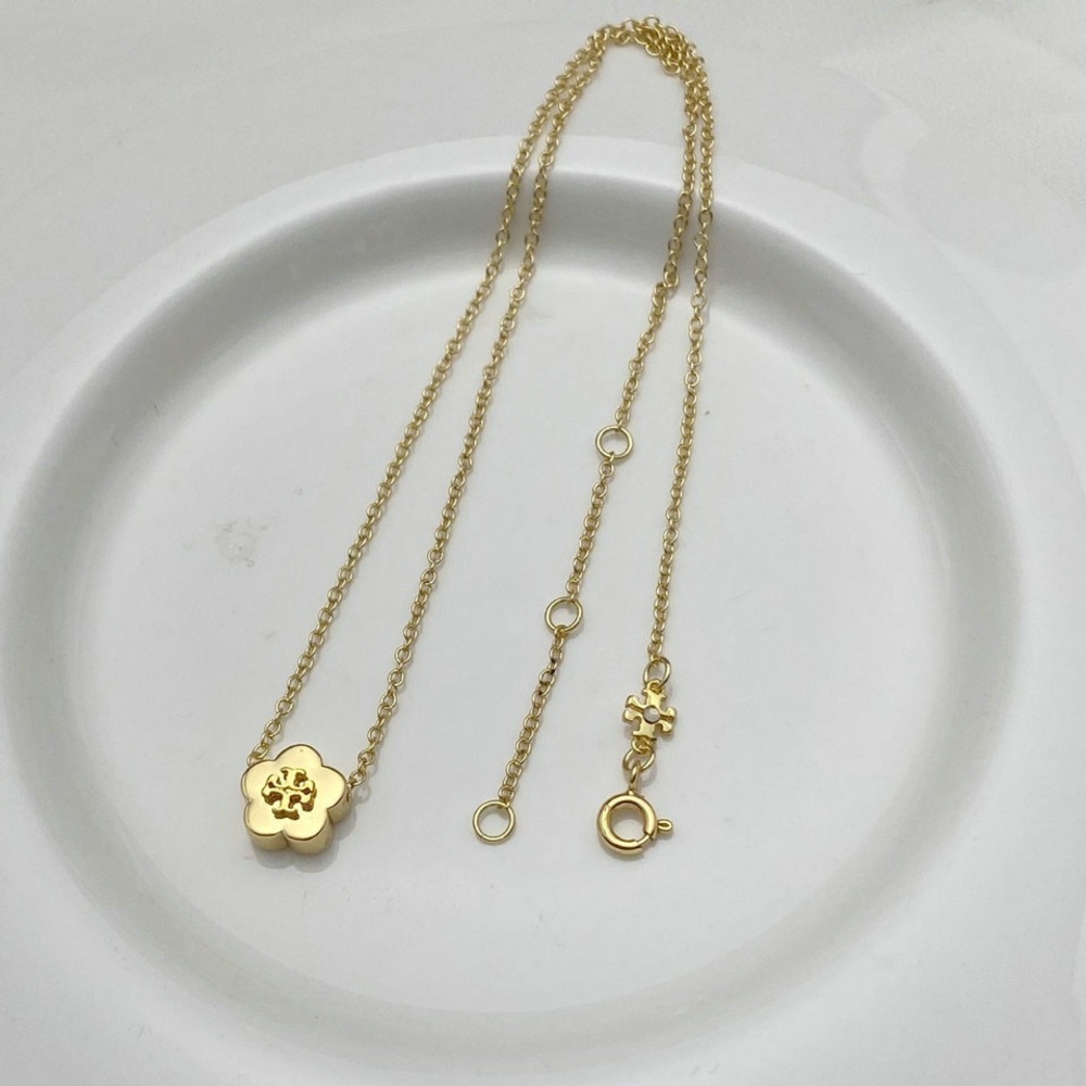 Tory Burch Elegant Gold Flower Pendant Necklace